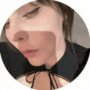 a close up of a woman 's face with a shadow on it .