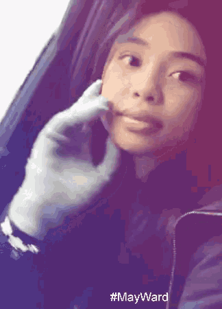 a woman 's face is being touched by a man 's hand in a car with #mayward written on the bottom
