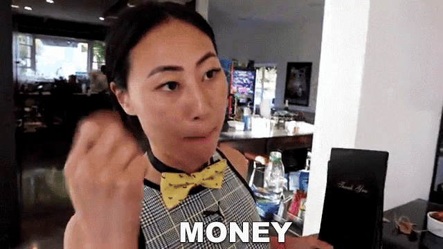 a woman wearing a bow tie and a plaid dress says money
