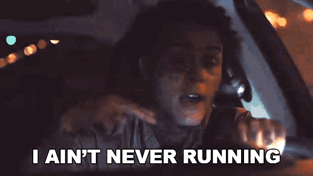 a man is driving a car at night and says i ain 't never running .