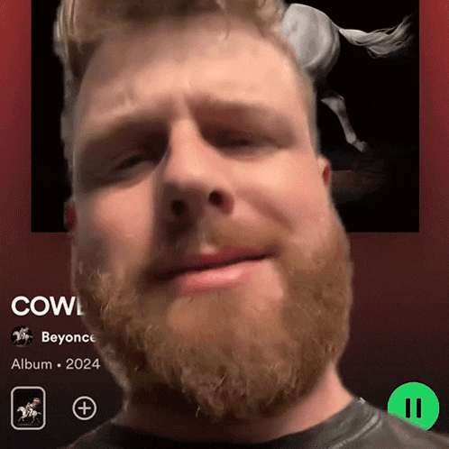 a man with a beard is playing a song called cowl