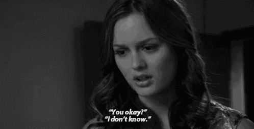 a woman says " you okay " and " i don t know " in a black and white photo