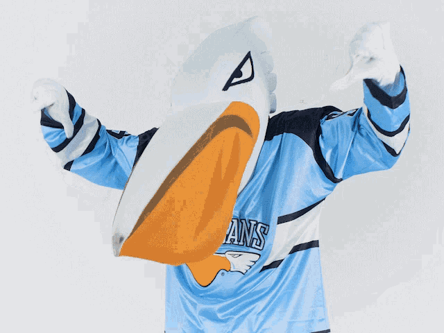 a pelican mascot is wearing a blue and white jersey that says pans