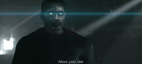 a man with glowing eyes and the words now you die behind him
