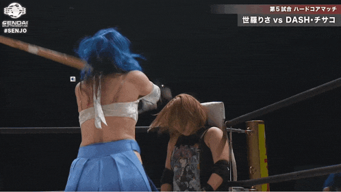 a woman with blue hair is fighting another woman in a ring