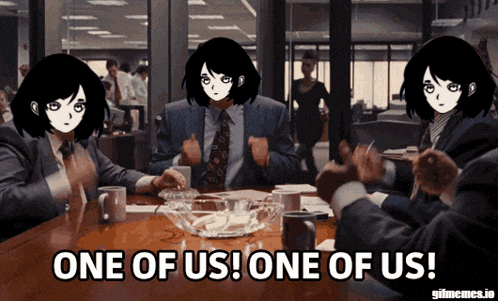 a group of people are sitting around a table with one of them saying one of us