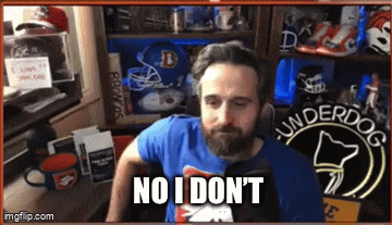 a man with a beard wearing a blue underdog shirt