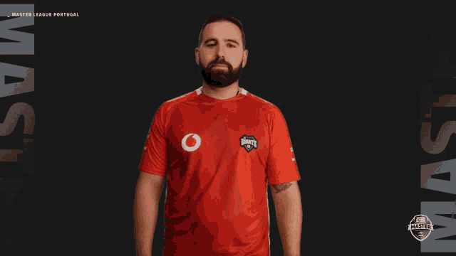 a man wearing a red shirt that says master league portugal on it