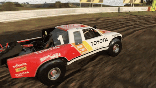 a red and white toyota truck with the number 1 on it