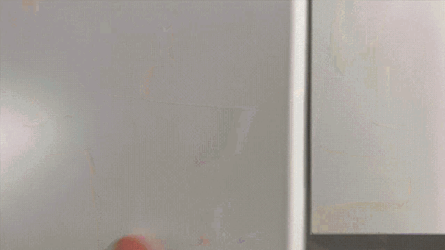 a white mug with a purple butterfly on it sits on a shelf