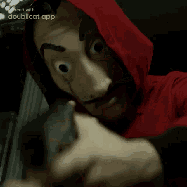 a man in a red shirt is being attacked by another man in a red shirt .