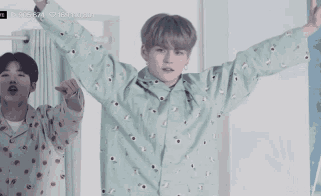 a man with his arms outstretched has the number 169,110,801 on the bottom