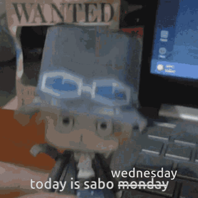 a wanted sign is behind a toy that says today is sabot monday