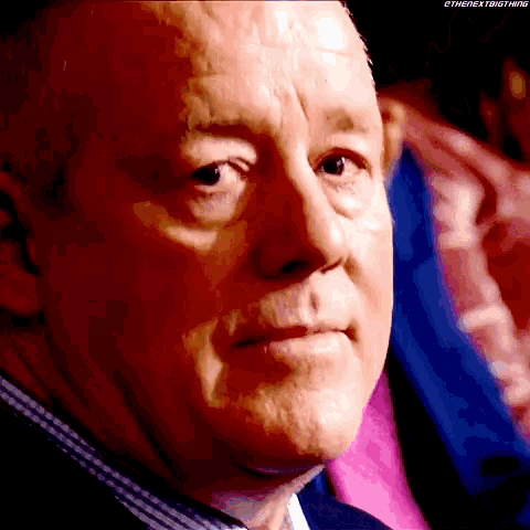 a close up of a man 's face with the words ethenextbigthing visible
