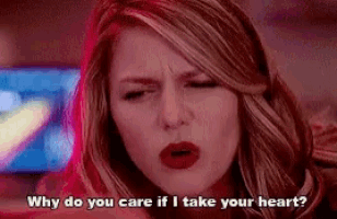 a woman is making a funny face and asking why do you care if i take your heart .