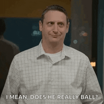 a man in a plaid shirt is smiling and asking , `` i mean , does he really ball ? ``