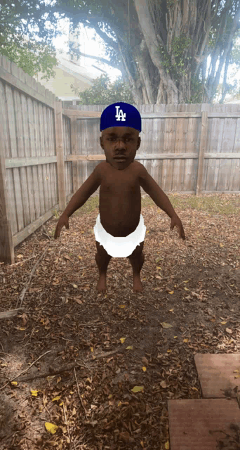 a baby wearing a la hat and diaper