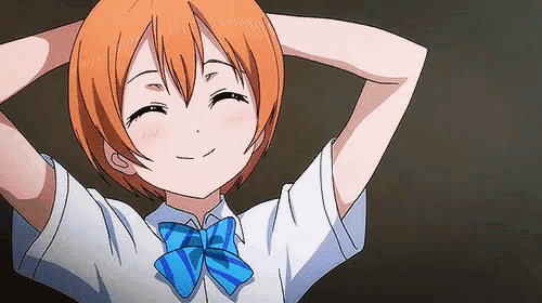 a girl with orange hair and a blue bow tie