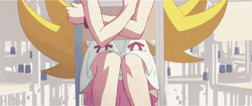 a girl with yellow wings is sitting on a pole with her arms crossed