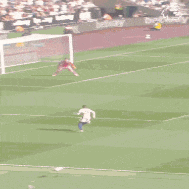 a soccer player with the number 15 on his jersey kicks the ball