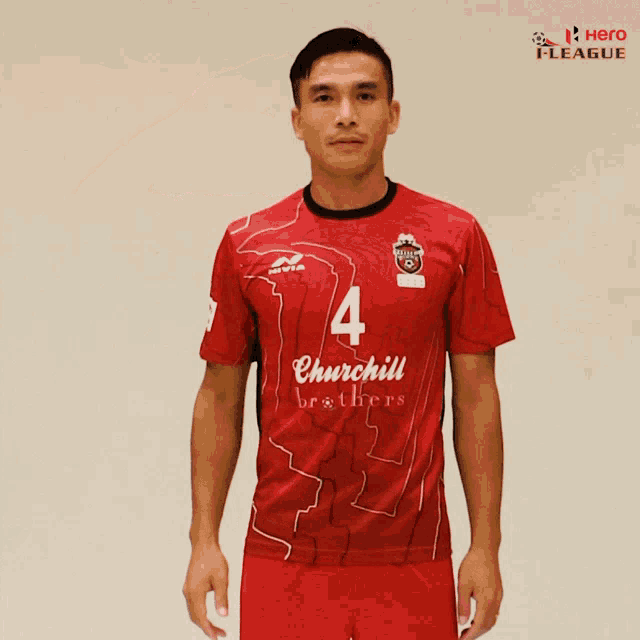 a man is wearing a red shirt that says churchill brothers