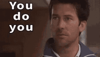 a man is pointing at the camera with his finger while saying `` you do you '' .