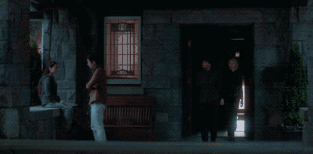 a blurry picture of a person standing in front of a house
