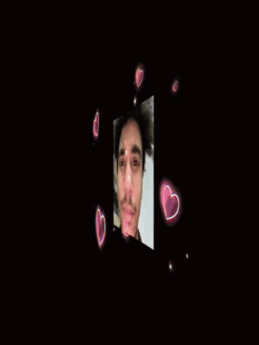 a man 's face is surrounded by glowing stars and clouds