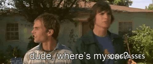 two men are standing in front of a house with the words dude where 's my song passes