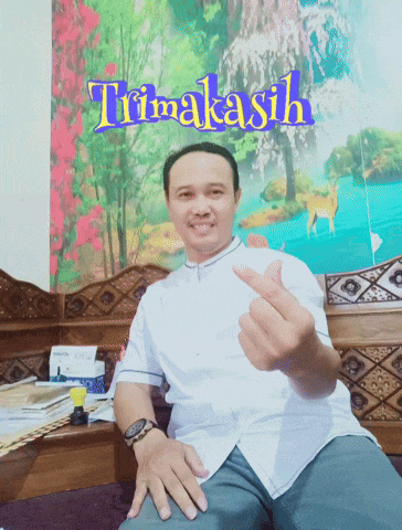 a man is giving the middle finger in front of a painting that says terima kasih