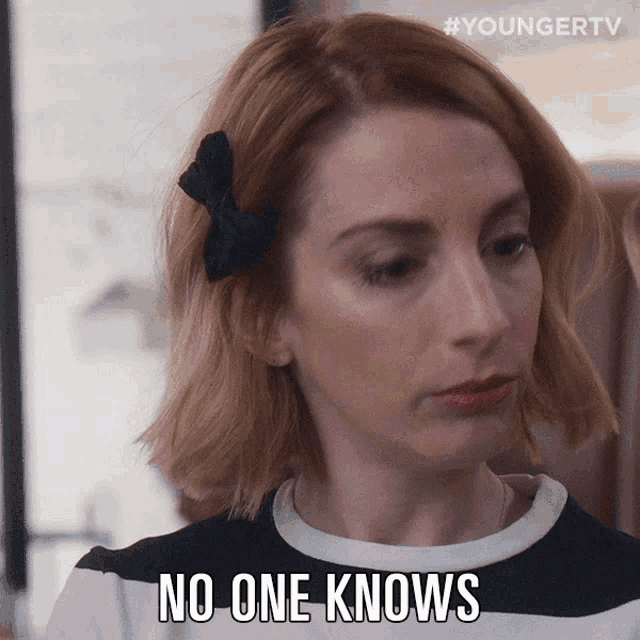 a woman says " no one knows " in a striped shirt