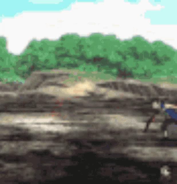a blurry picture of a person riding a horse on a dirt road .
