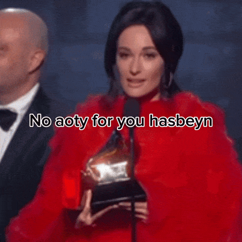 a woman is wearing a red dress and a necklace and says help me kacey