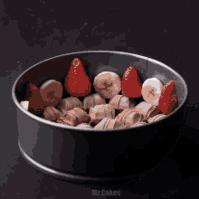 a pan filled with strawberries bananas and chocolate pieces