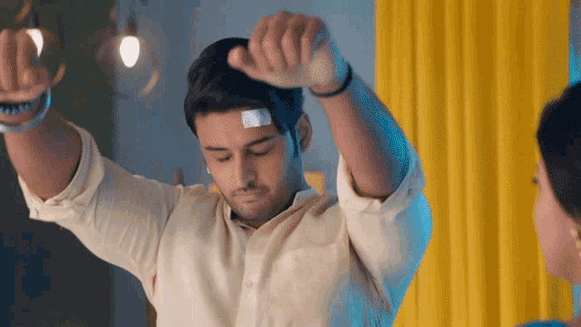 a man with a bandage on his forehead