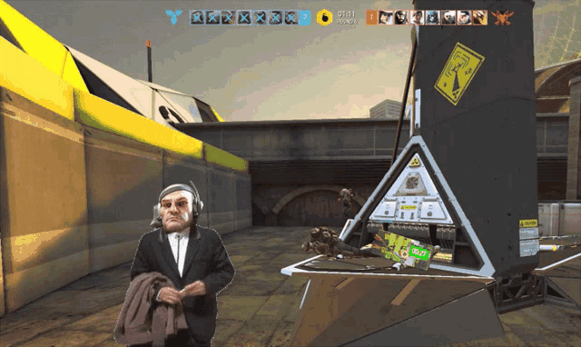 a man in a suit and tie is standing in front of a machine with a sign that says " warning "
