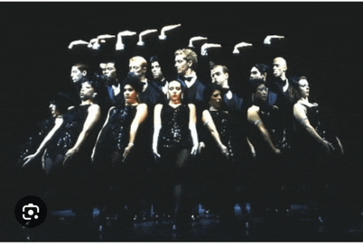 a group of people are standing in a row with a black background