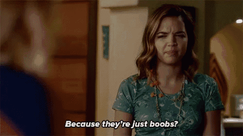 a woman in a green shirt is talking to another woman .