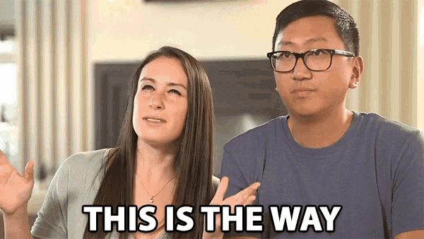 a man and a woman sitting next to each other with the words this is the way written on the screen