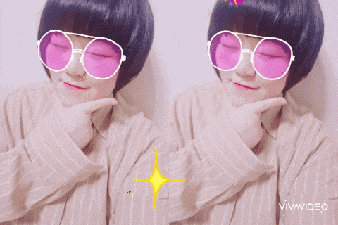 a girl wearing pink sunglasses has a vivavideo watermark on the bottom