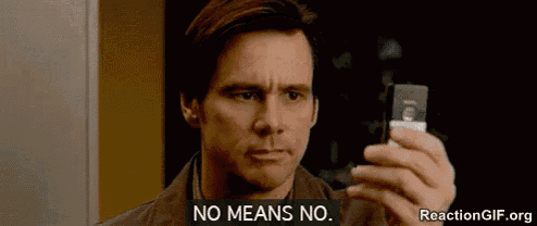 a man is holding a cell phone and says no means no