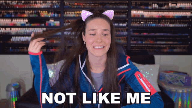 a woman with a cat ear headband is saying not like me