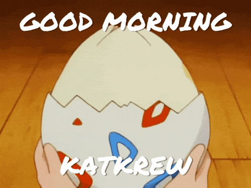 someone is holding an egg with the words good morning katkrew written on it