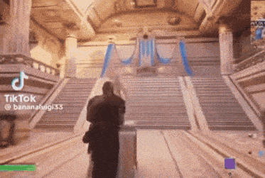 a man is walking down a set of stairs in a video game with a tiktok watermark .