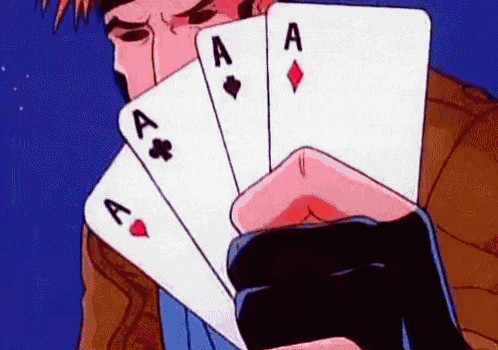 a man is holding a stack of playing cards in his hand .