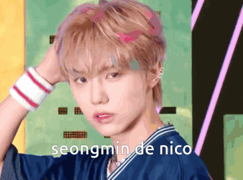 seongmin de nico is written on a picture of a young man