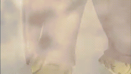 a close up of a person standing in front of a window with a reflection of a person in the window .