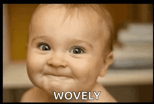 a baby making a face with the word wovely above it