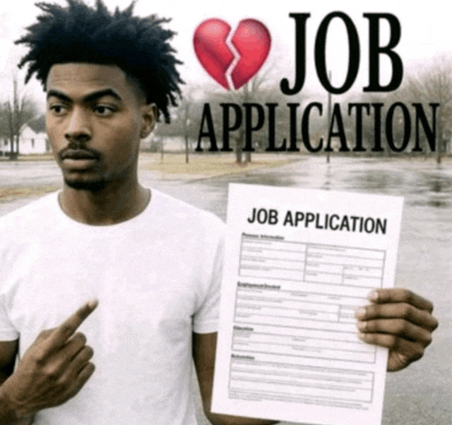 a man is holding a job application with a broken heart on it