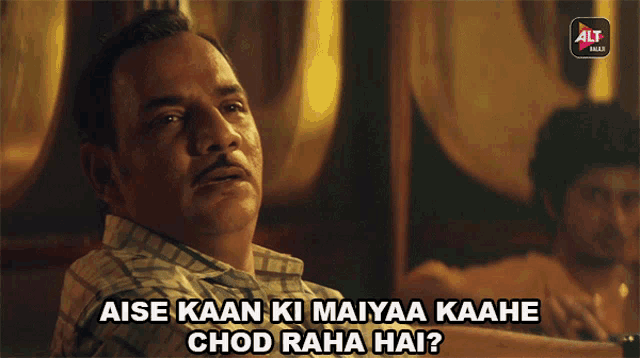 a man in a plaid shirt says aise kaan ki mayyaa kaahe chod raha hai